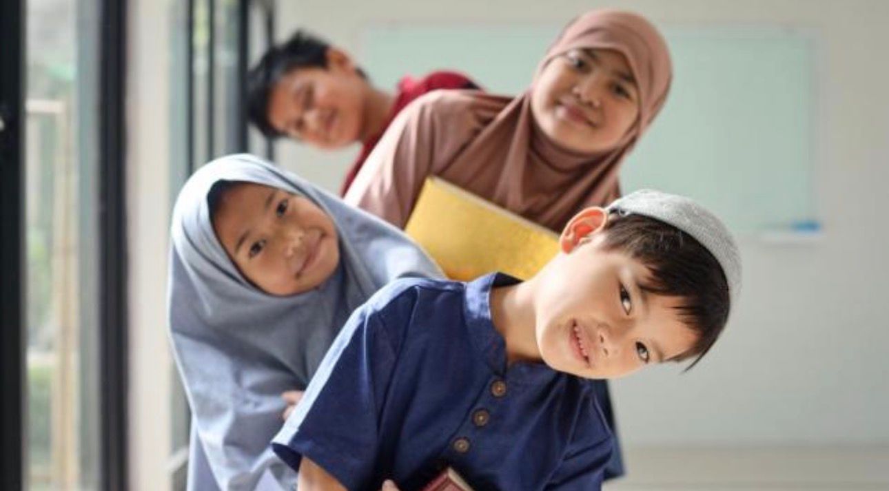 Happy students learning with their teacher